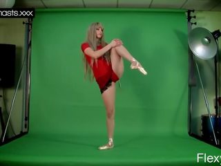 Red Dressed Gymnast Doing Spreads